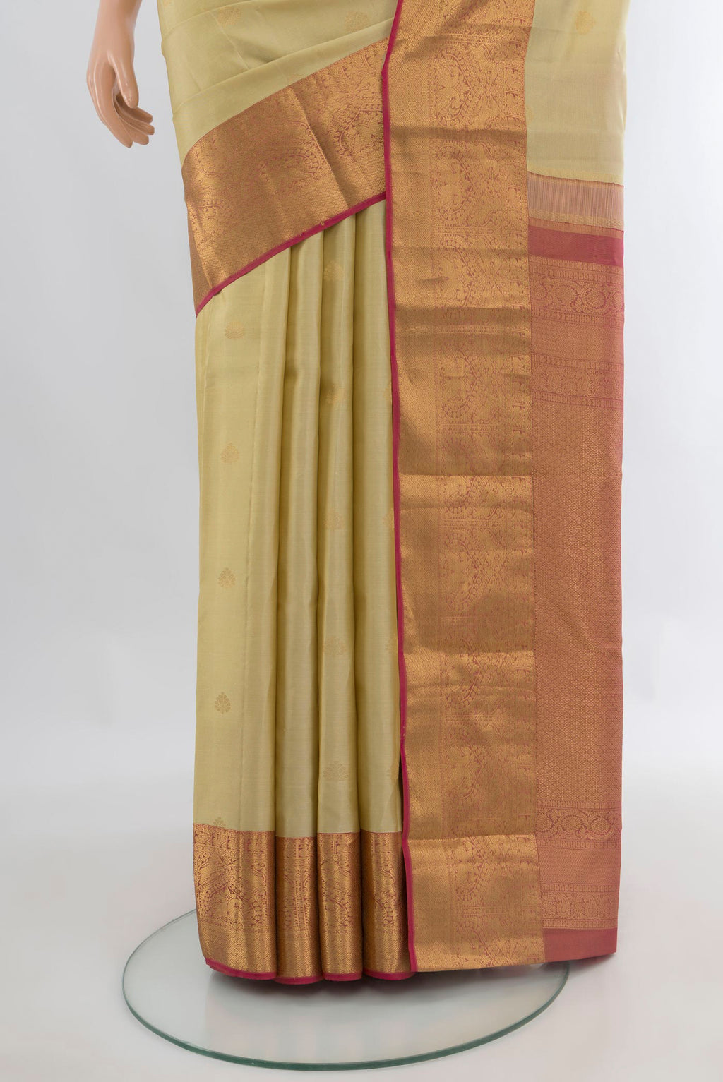 Pleats and pallu of Pure Silk Sandal Kanjivaram Saree with Zari Butta on the body and Zari Border. 