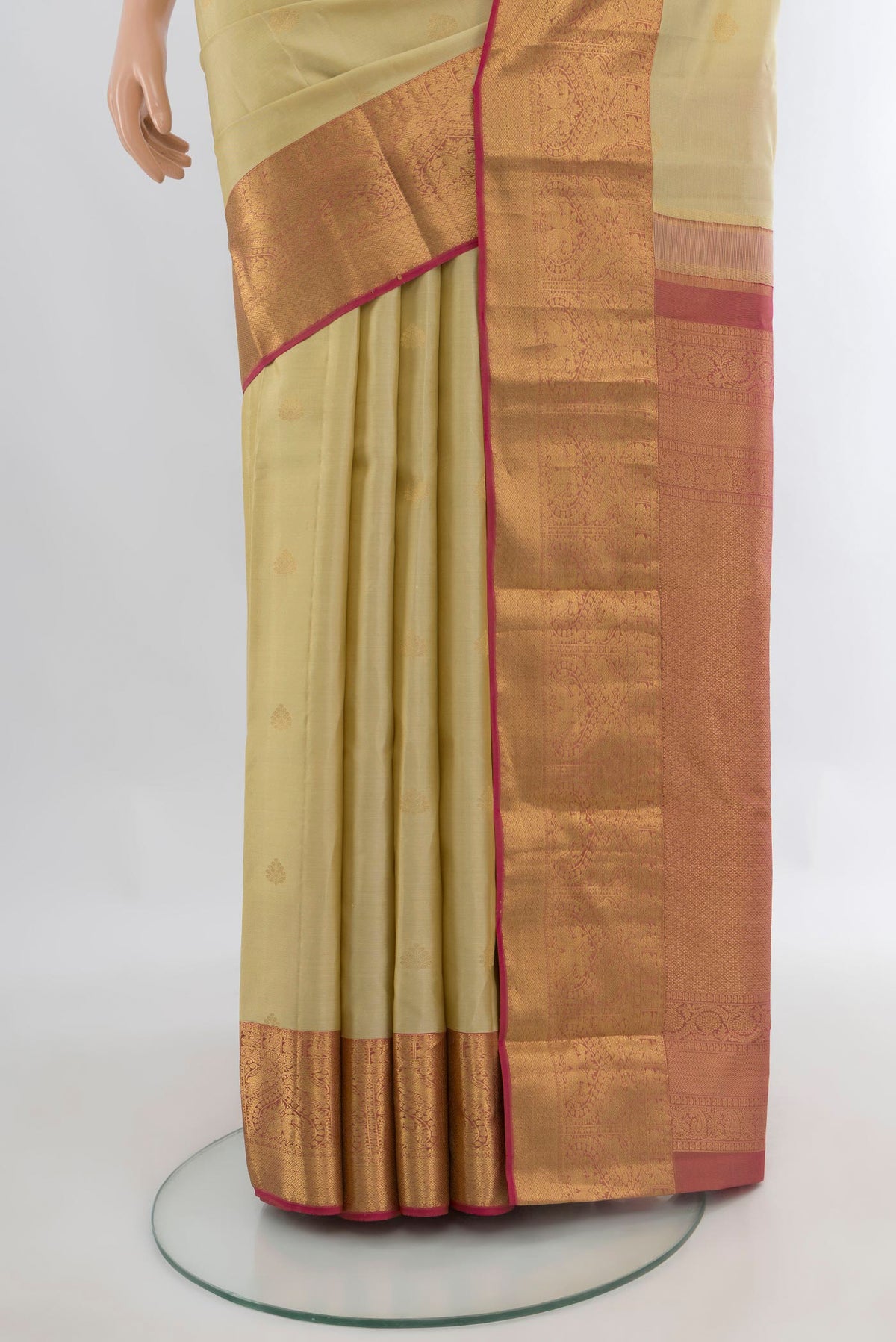 Pleats and pallu of Pure Silk Sandal Kanjivaram Saree with Zari Butta on the body and Zari Border. 