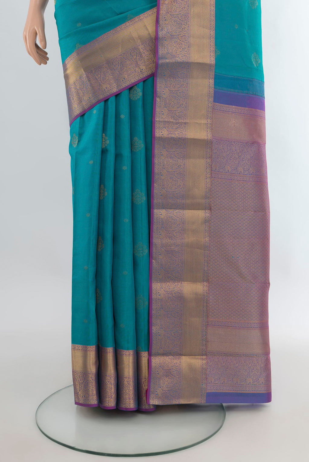 Pleats and pallu of Pure Silk Turquoise Kanjivaram Saree with Zari Butta on the body and Zari Border. 