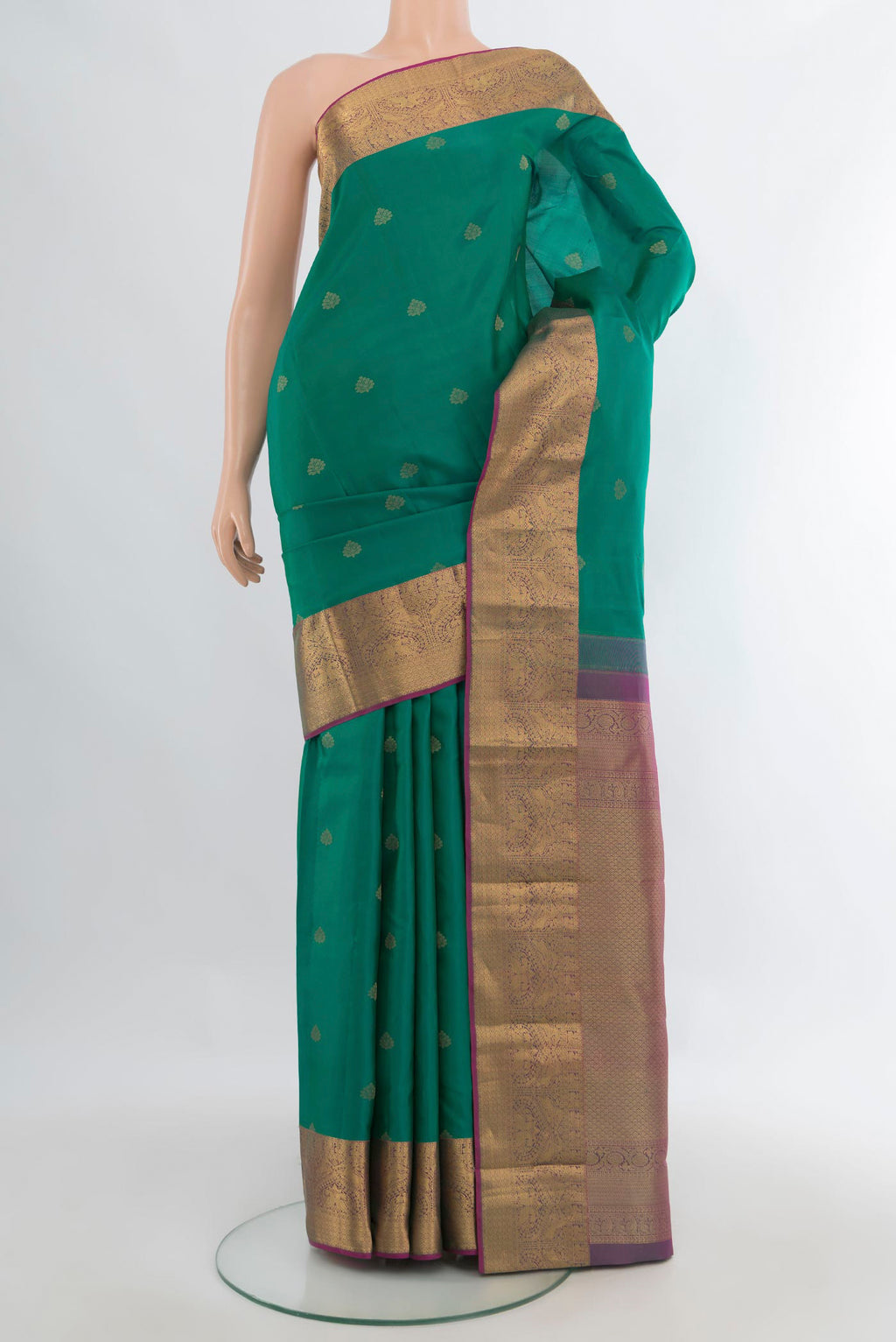 Pure Silk Sea Green Kanjivaram Saree with Zari Butta on the body and Zari Border.  displayed on a mannequin