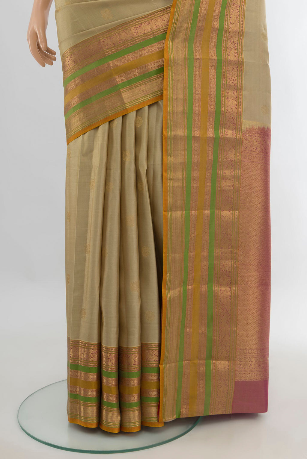 Pleats and pallu of Pure Silk Beige Kanjivaram Saree with Zari Butta on the body and Zari Border. 