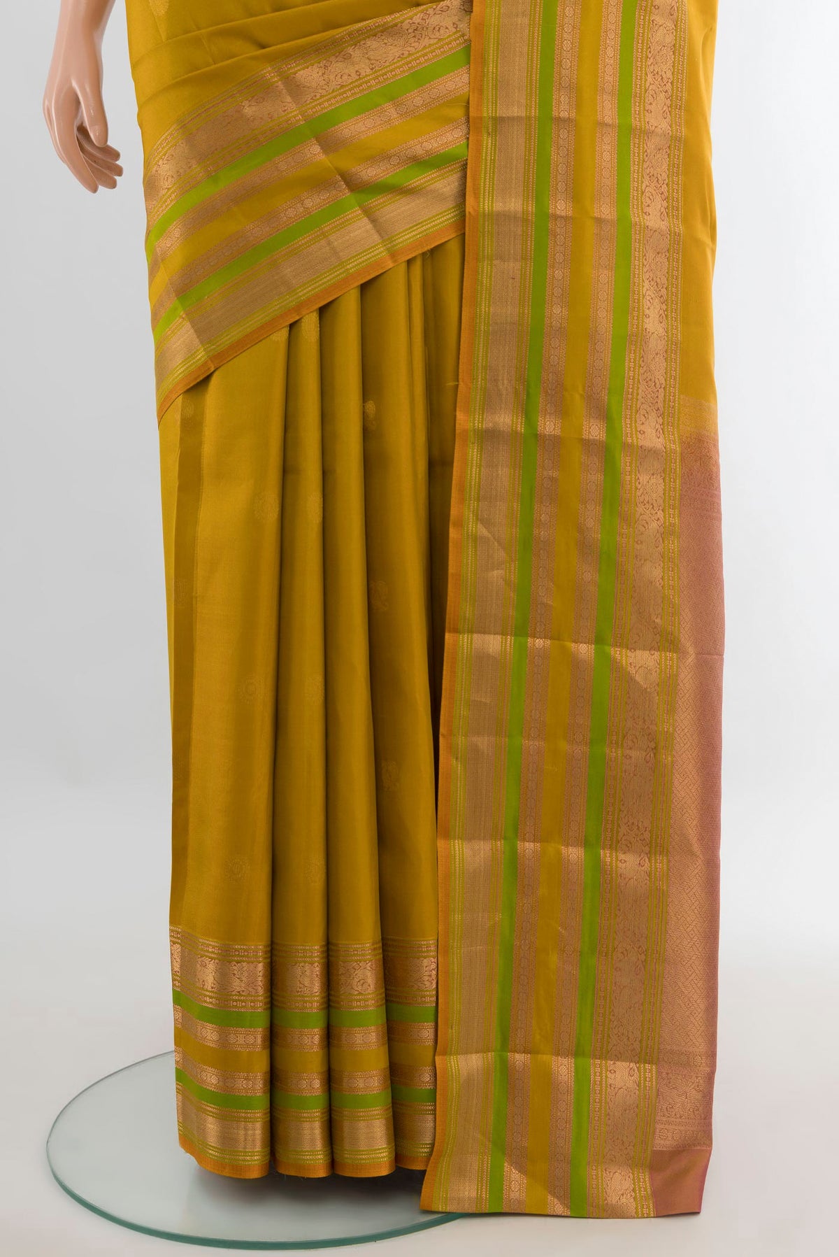 Pleats and pallu of Pure Silk Mustard Kanjivaram Saree with Zari Butta on the body and Zari Border. 