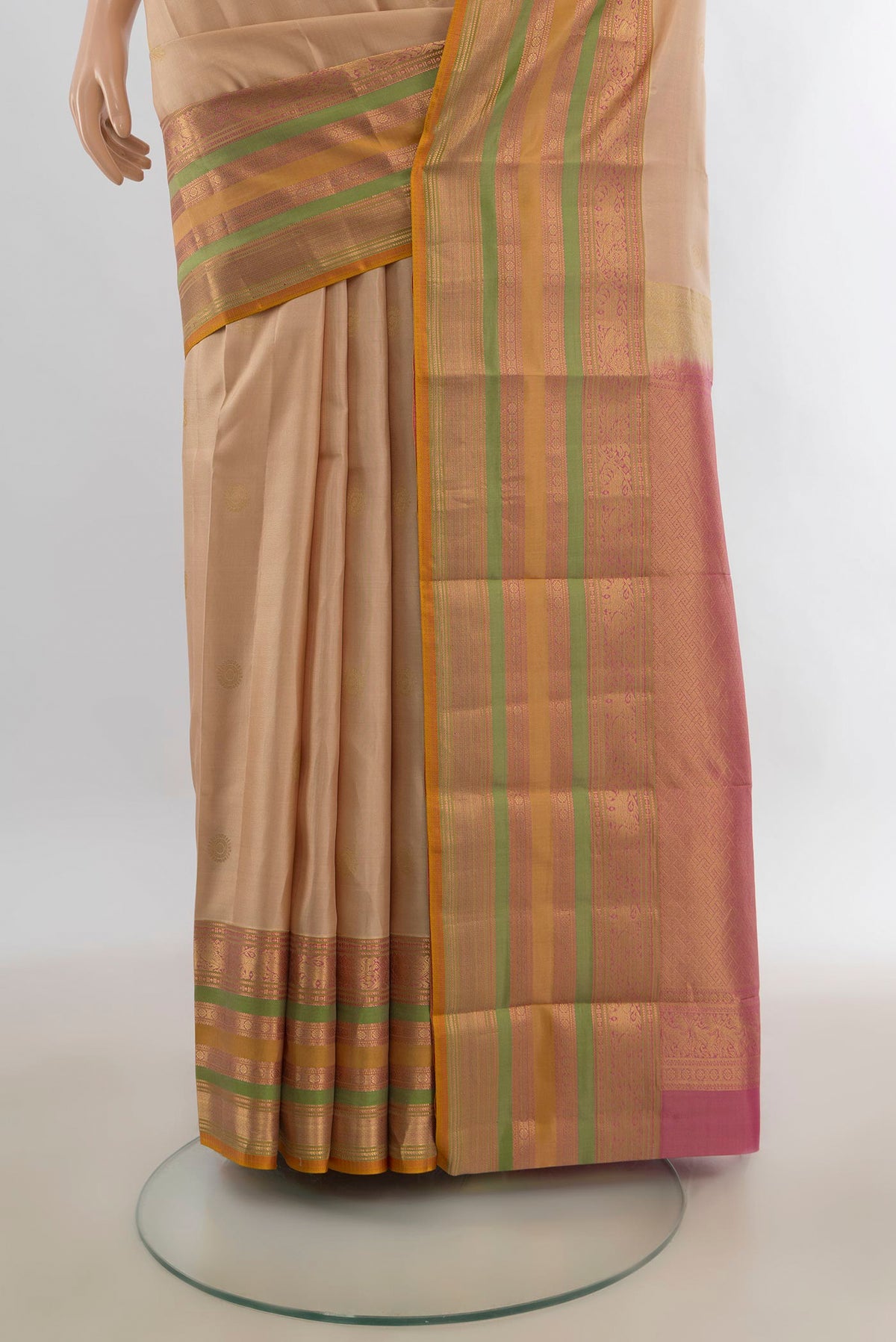 Pleats and pallu of Pure Silk Beige Kanjivaram Saree with Plain Body and Zari Border. 