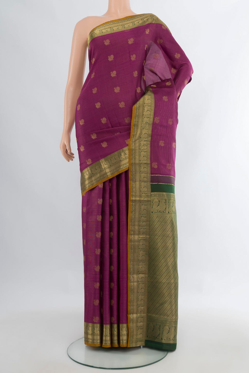 Pure Silk Mauve Kanchipuram Saree with Zari Butta on the body and Zari Border.  displayed on a mannequin