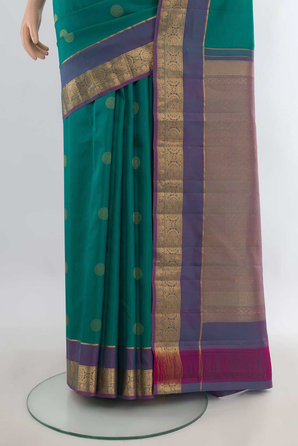 Pleats and pallu of Pure Silk Green Kanchipuram Saree with Zari Butta on the body and Zari Border. 