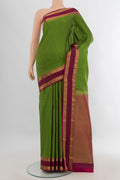 Pure Silk Green Kanchipuram Saree with Stripes on the body and Zari Border.  displayed on a mannequin