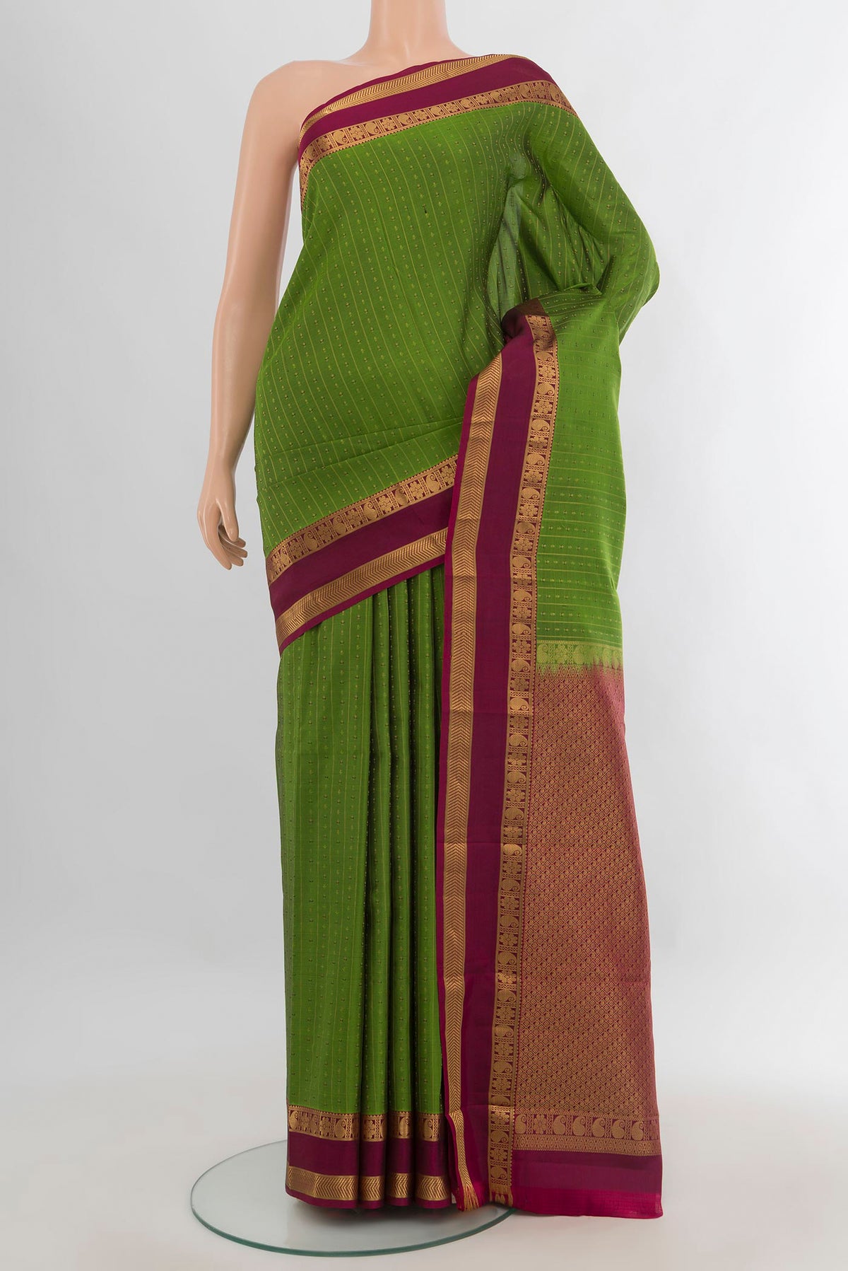 Pure Silk Green Kanchipuram Saree with Stripes on the body and Zari Border.  displayed on a mannequin
