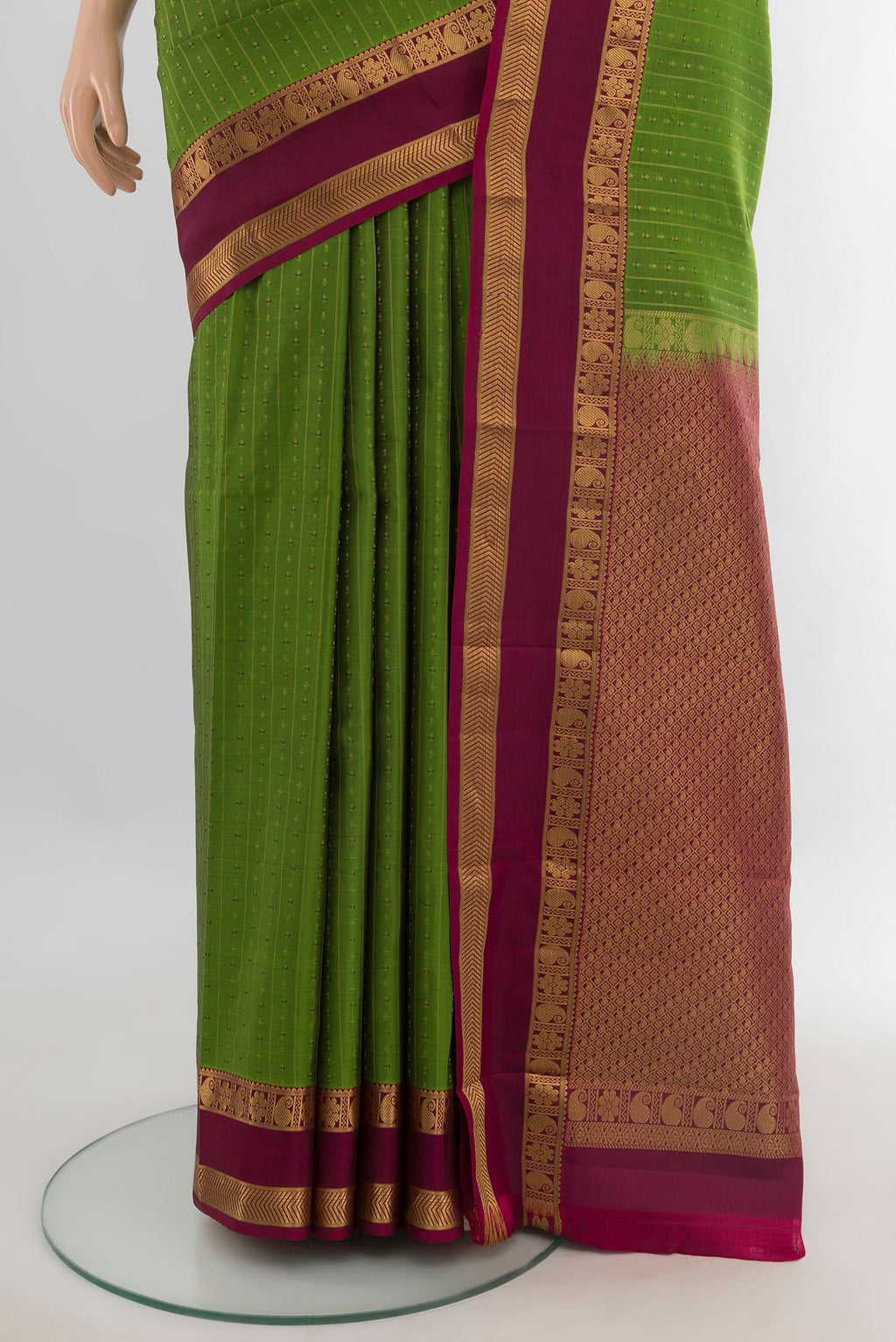 Pleats and pallu of Pure Silk Green Kanchipuram Saree with Stripes on the body and Zari Border. 