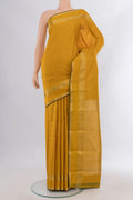 Pure Silk Mustard Kanjivaram Saree with Zari Butta on the body and Zari Border.  displayed on a mannequin