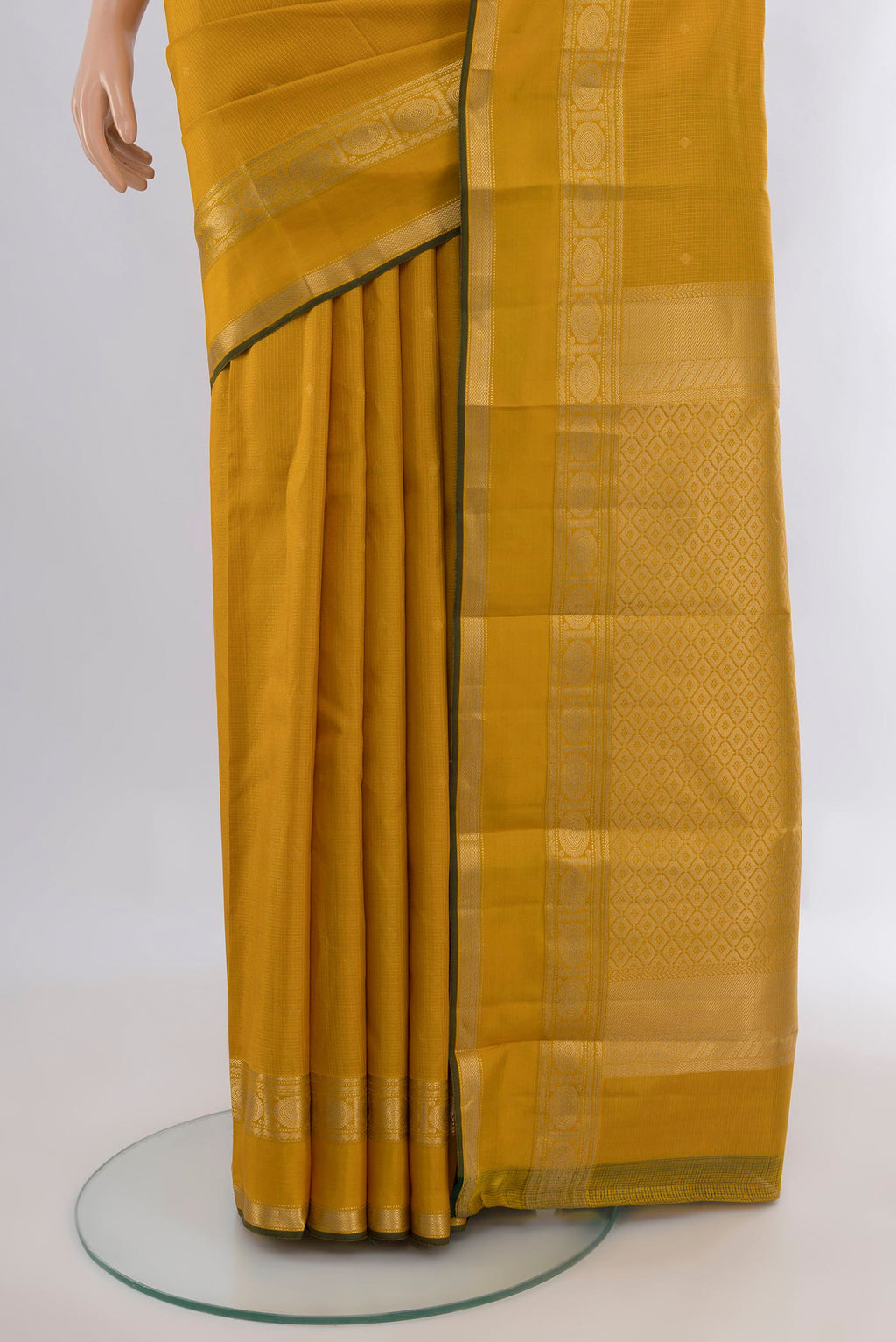 Pleats and pallu of Pure Silk Mustard Kanjivaram Saree with Zari Butta on the body and Zari Border. 