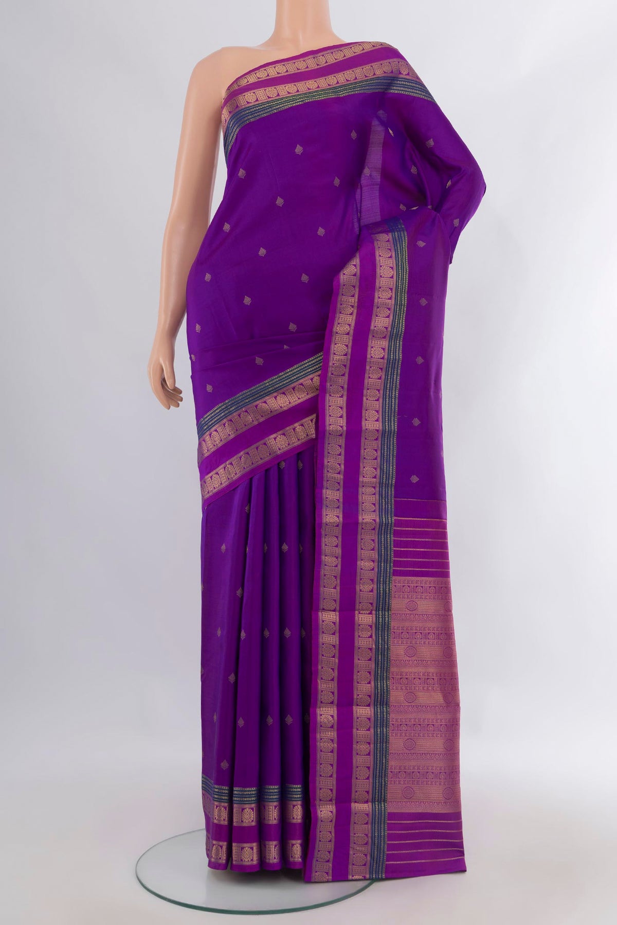 Pure Silk Purple Kanchipuram Saree with Zari Butta on the body and Zari Border.  displayed on a mannequin