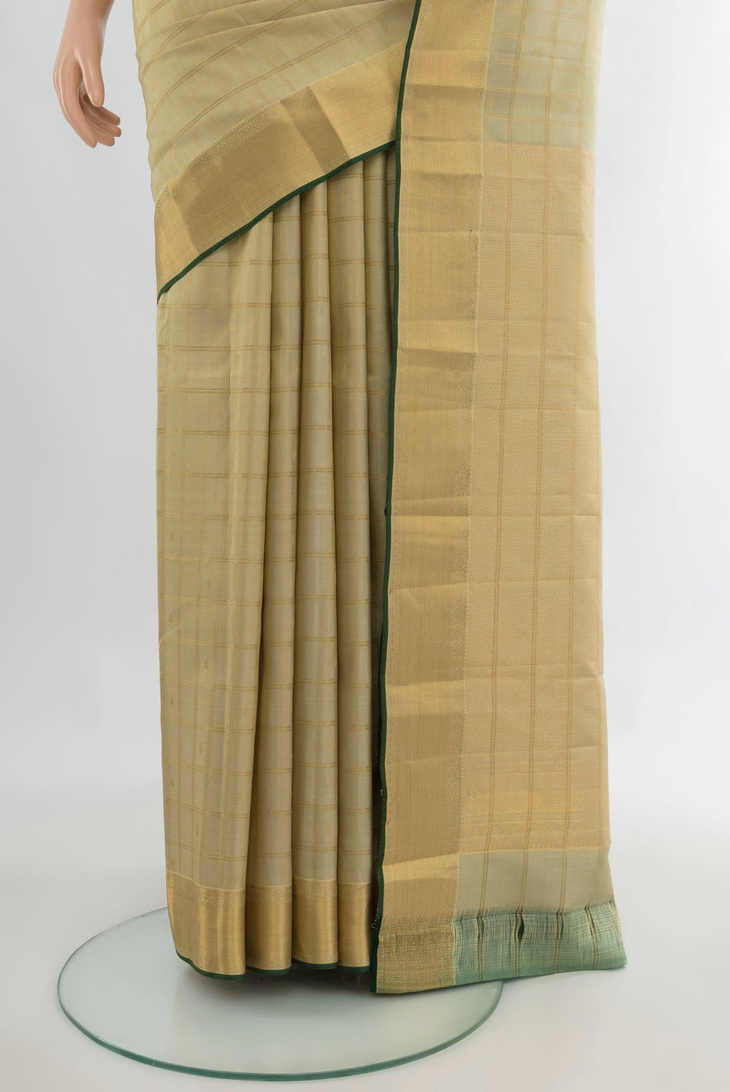 Pleats and pallu of Pure Silk Sandal Kanchipuram Saree with Stripes on the body and Zari Border. 