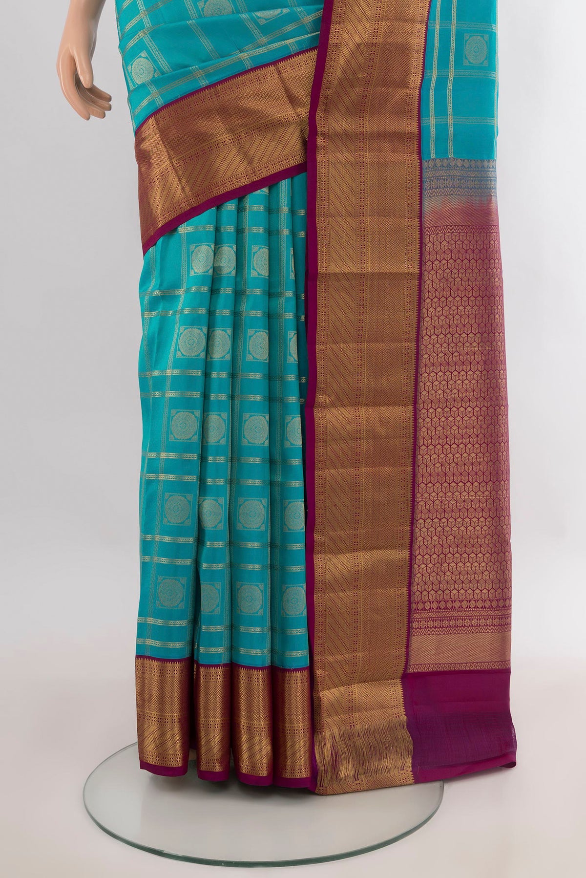 Pleats and pallu of Pure Silk Turquoise Kanchipuram Saree with Checked design on the body and Zari Border. 