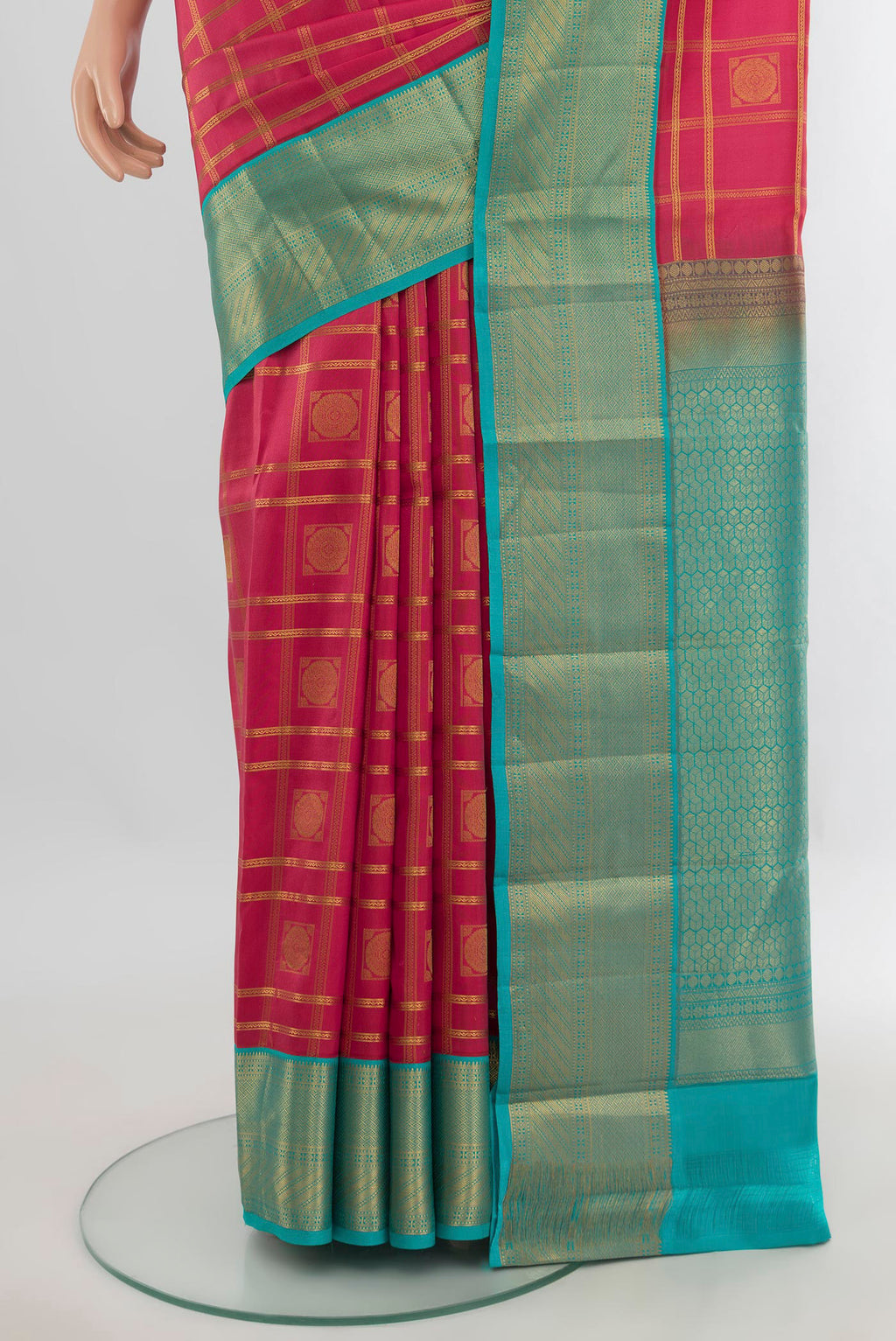 Pleats and pallu of Pure Silk Coral Kanchipuram Saree with Checked design on the body and Zari Border. 