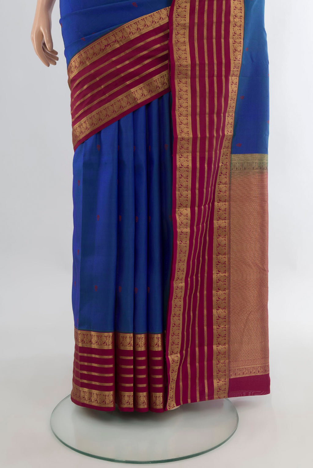 Pleats and pallu of Pure Silk Blue Kanjivaram Saree with Thread Butta on the body and Zari Border. 
