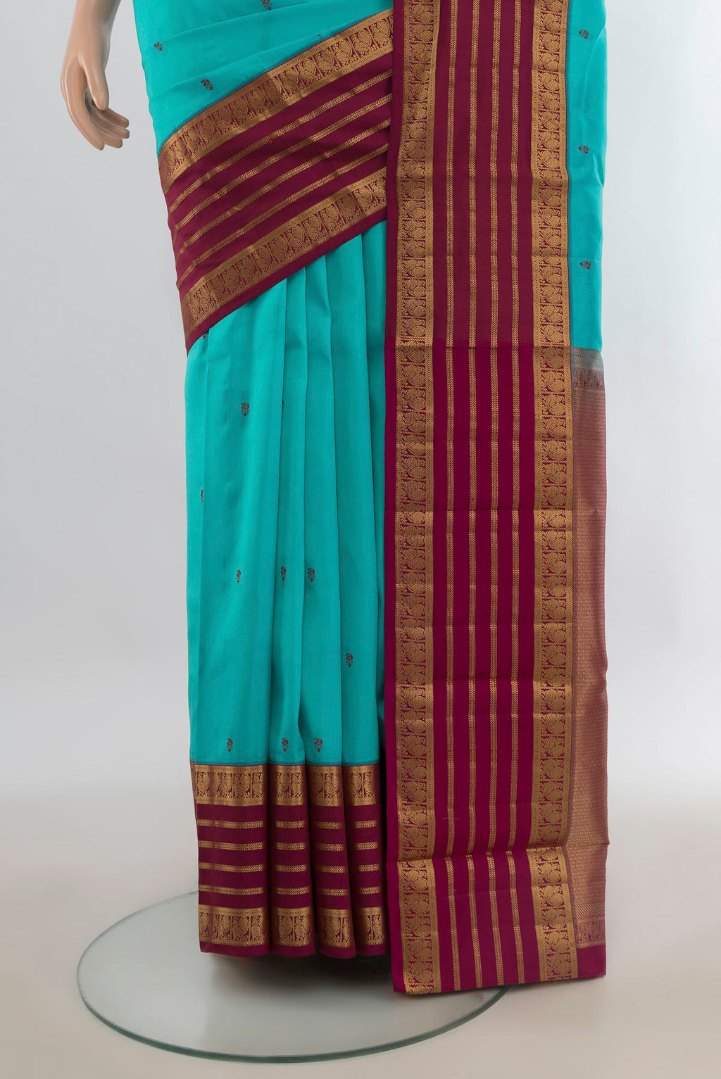Pleats and pallu of Pure Silk Turquoise Kanjivaram Saree with Thread Butta on the body and Zari Border. 