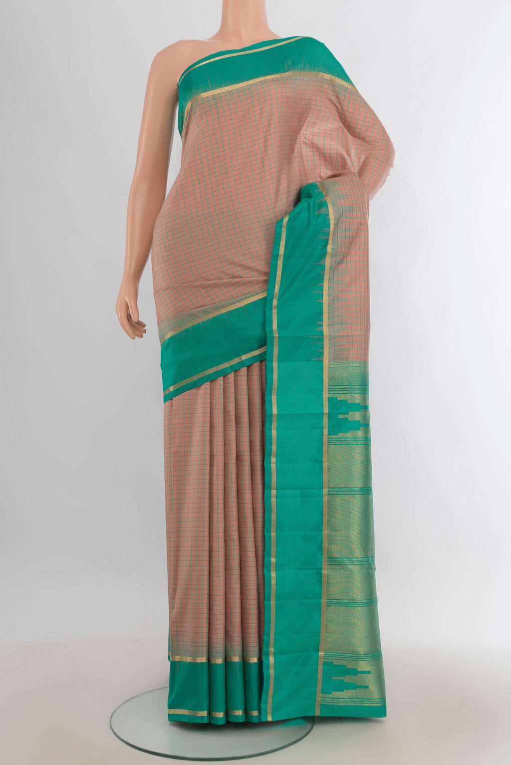 Pure Silk Rose Gold Kanchipuram Saree with Checked design on the body and Silk Border.  displayed on a mannequin