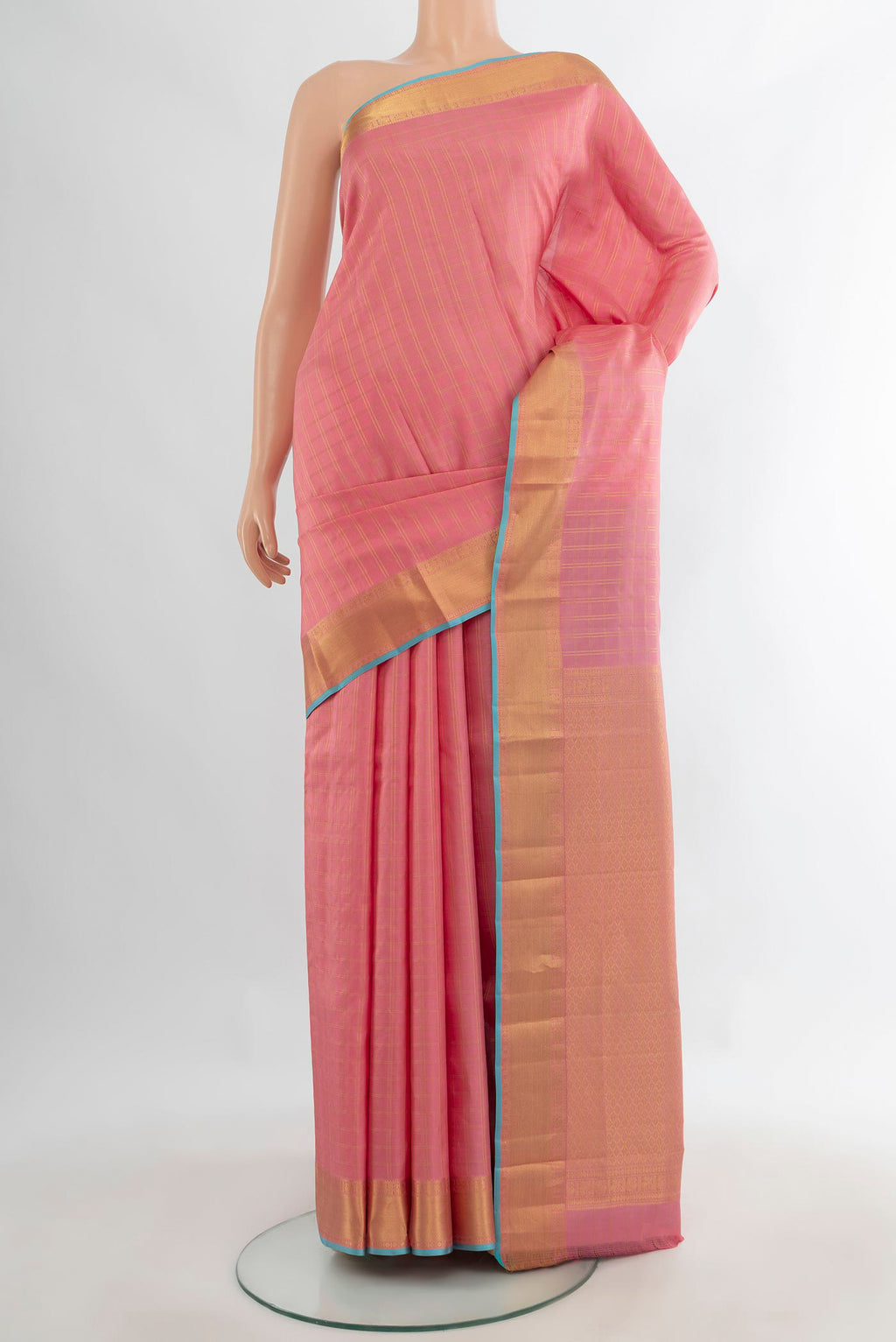 Pure Silk Peach Kanchipuram Saree with Checked design on the body and Zari Border.  displayed on a mannequin