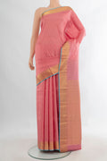 Pure Silk Peach Kanchipuram Saree with Checked design on the body and Zari Border.  displayed on a mannequin