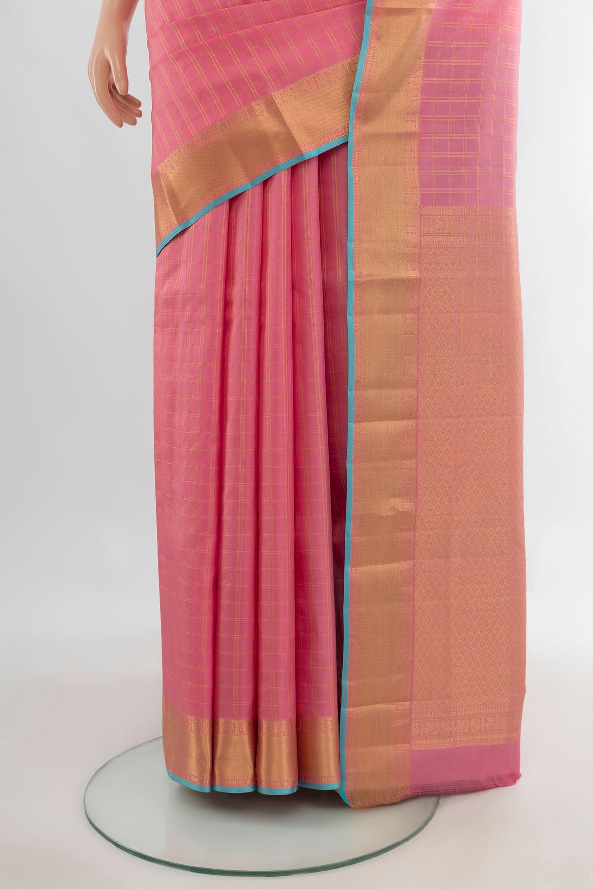 Pleats and pallu of Pure Silk Peach Kanchipuram Saree with Checked design on the body and Zari Border. 