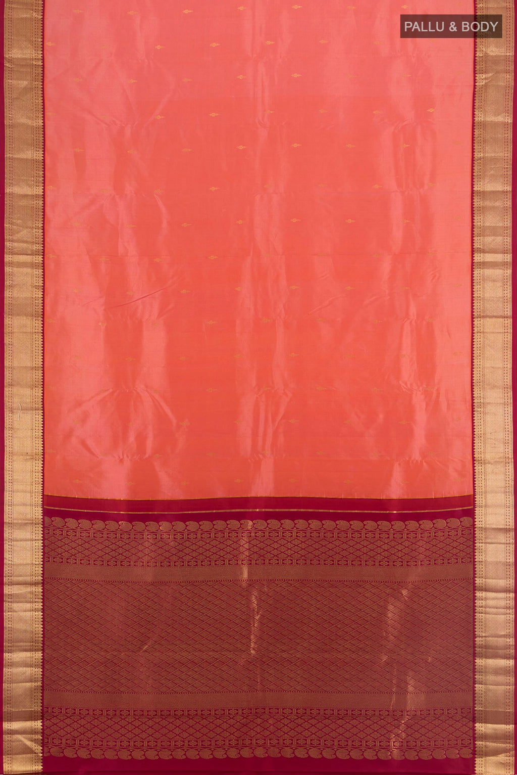 Flat view of Pure Silk Coral Kanchipuram Saree with Zari Butta on the body and Zari Border. 