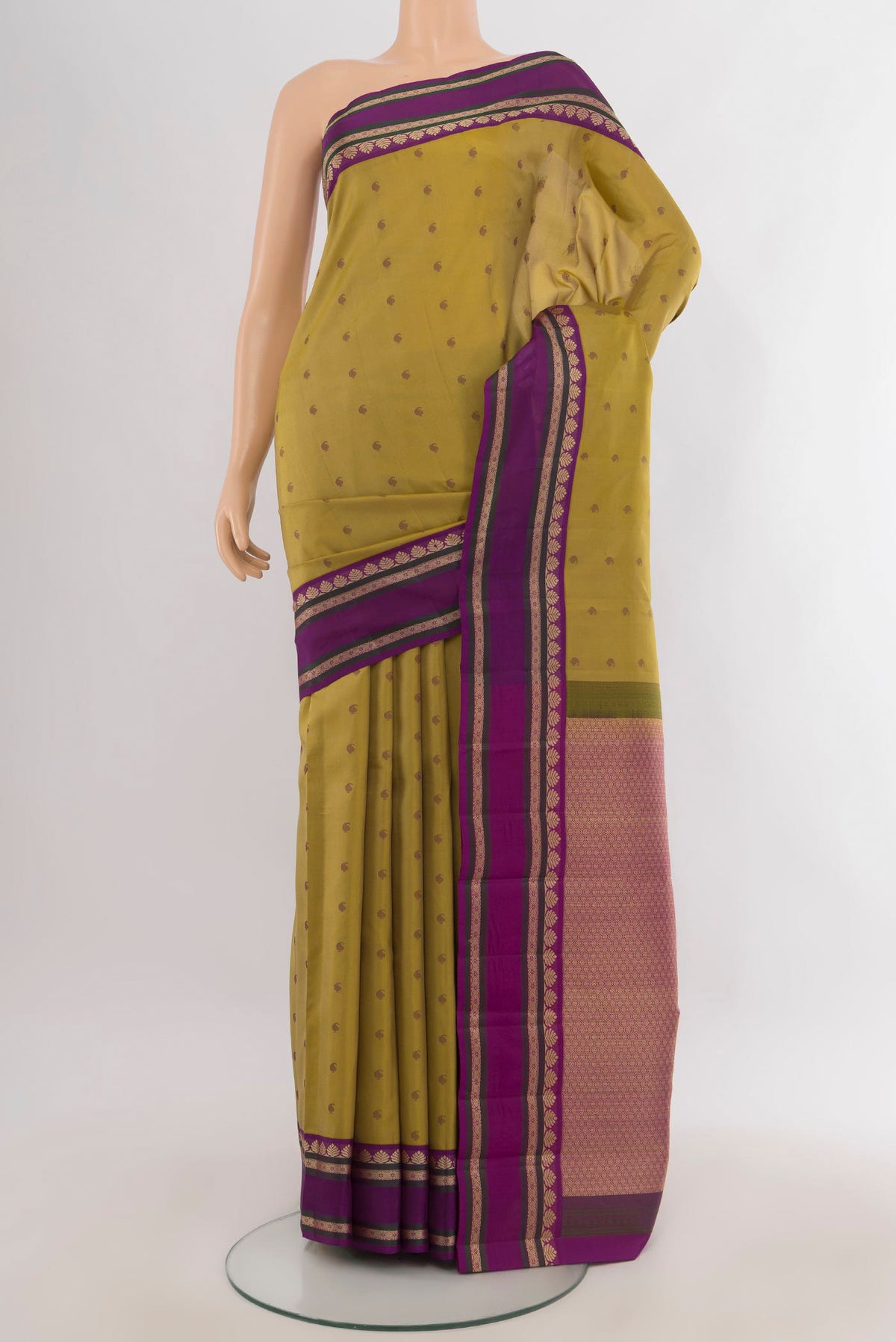 Pure Silk Mustard Kanjivaram Saree with Thread Butta on the body and Thread Border.  displayed on a mannequin