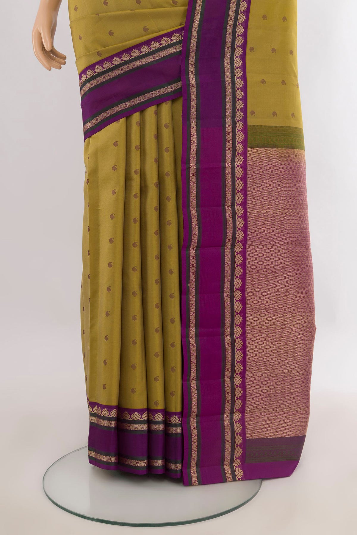 Pleats and pallu of Pure Silk Mustard Kanjivaram Saree with Thread Butta on the body and Thread Border. 