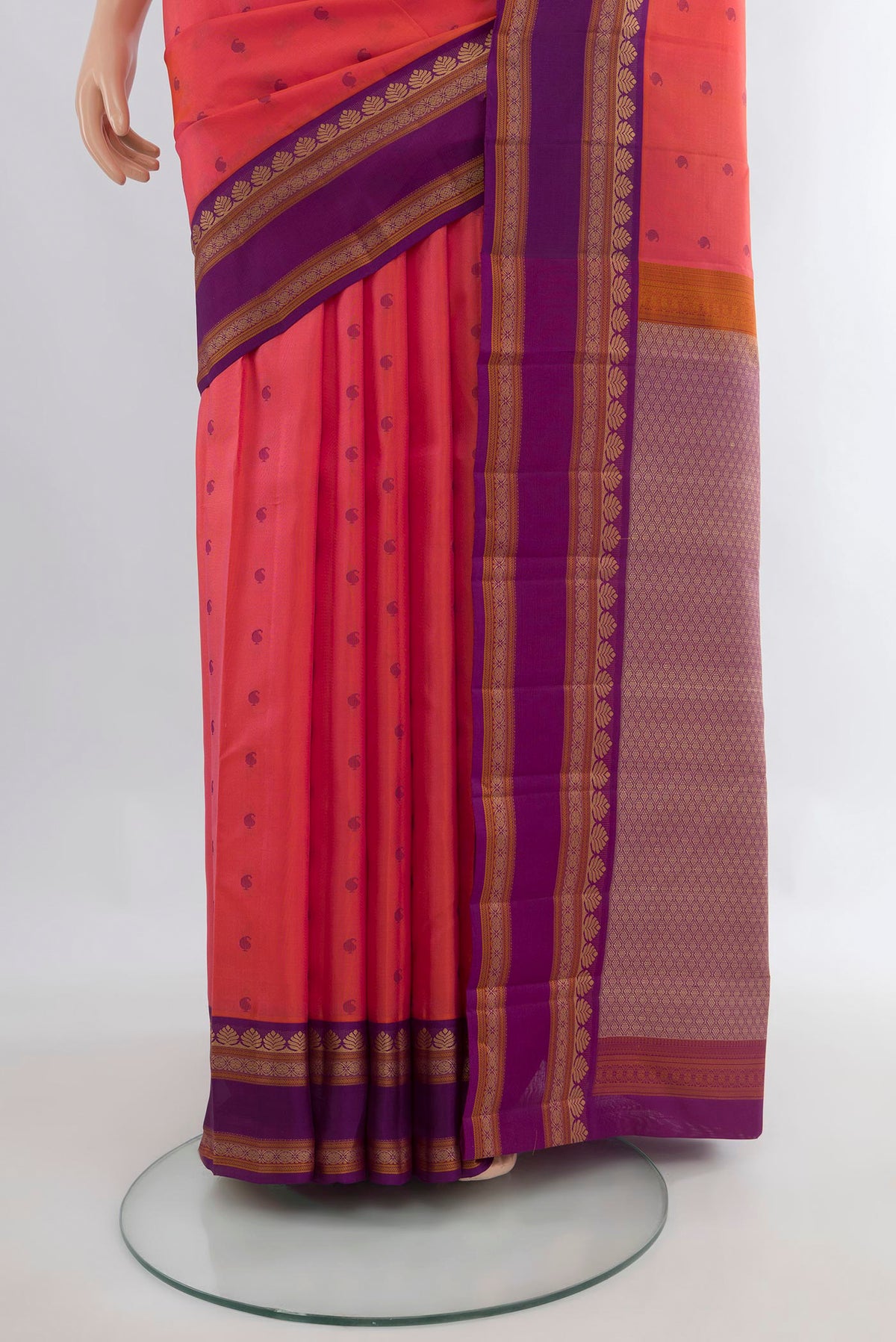 Pleats and pallu of Pure Silk Coral Kanjivaram Saree with Thread Butta on the body and Thread Border. 