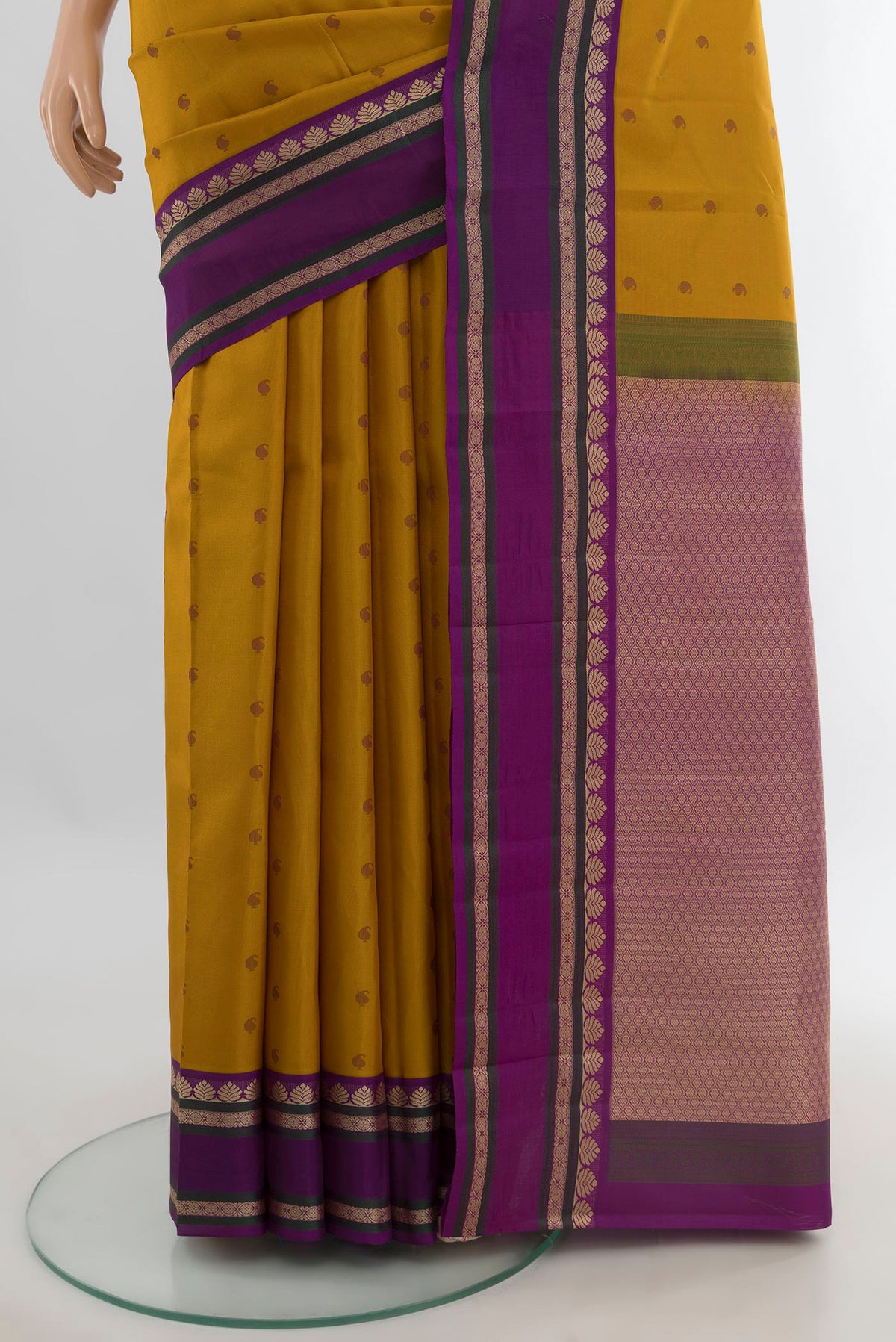 Pleats and pallu of Pure Silk Mustard Kanjivaram Saree with Thread Butta on the body and Thread Border. 