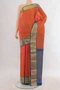 Pure Silk Orange Kanjivaram Saree with Zari Butta on the body and Zari Border.  displayed on a mannequin