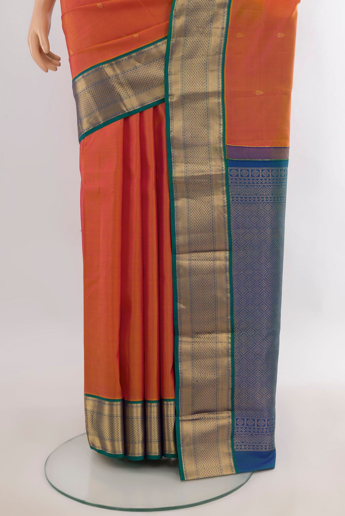 Pleats and pallu of Pure Silk Orange Kanjivaram Saree with Zari Butta on the body and Zari Border. 