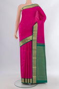Pure Silk Pink Kanjivaram Saree with Zari Butta on the body and Zari Border.  displayed on a mannequin