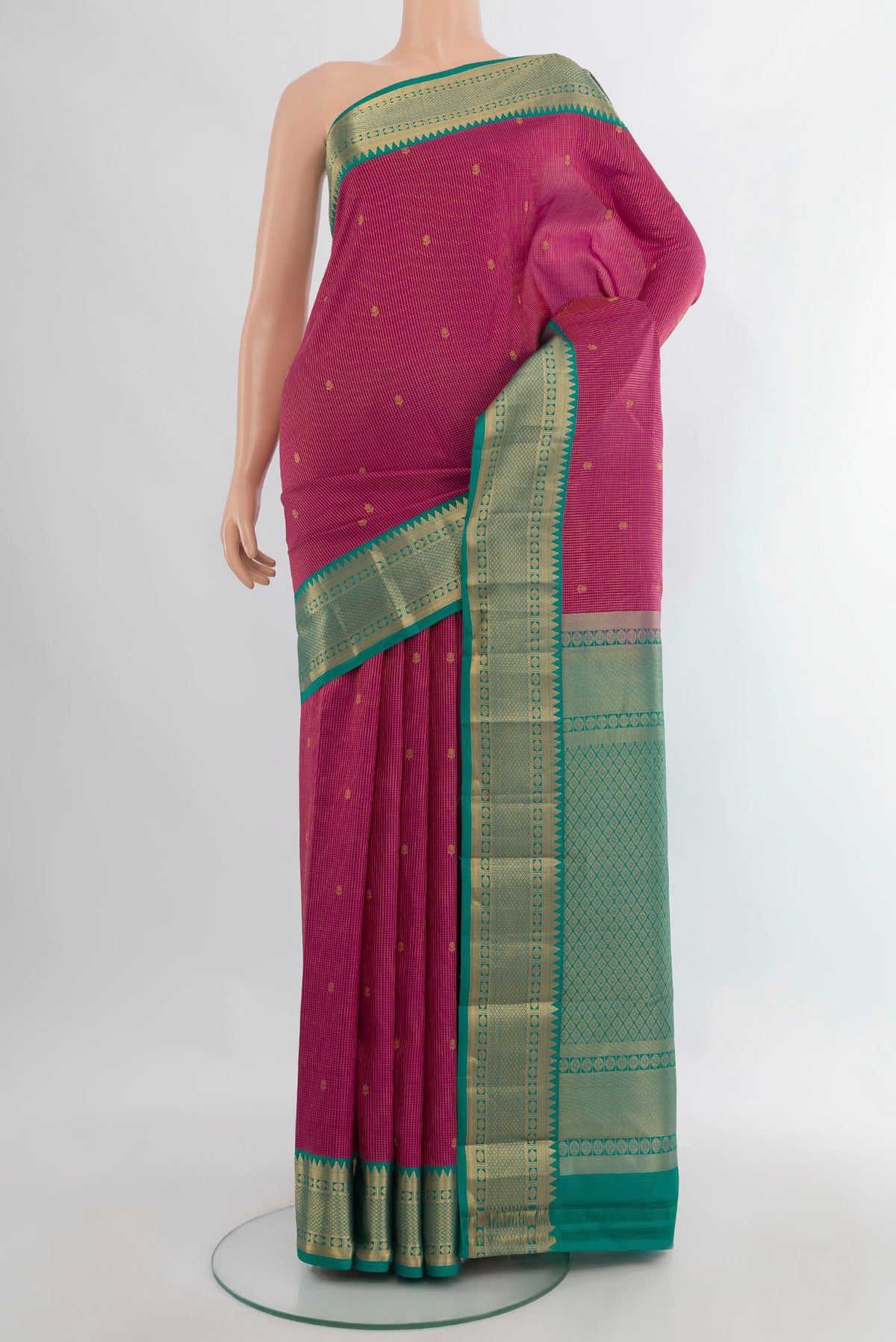 Pure Silk Pink Kanjivaram Saree with Zari Butta on the body and Zari Border.  displayed on a mannequin
