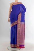 Pure Silk Royal Blue Kanchipuram Saree with Stripes on the body and Zari Border.  displayed on a mannequin