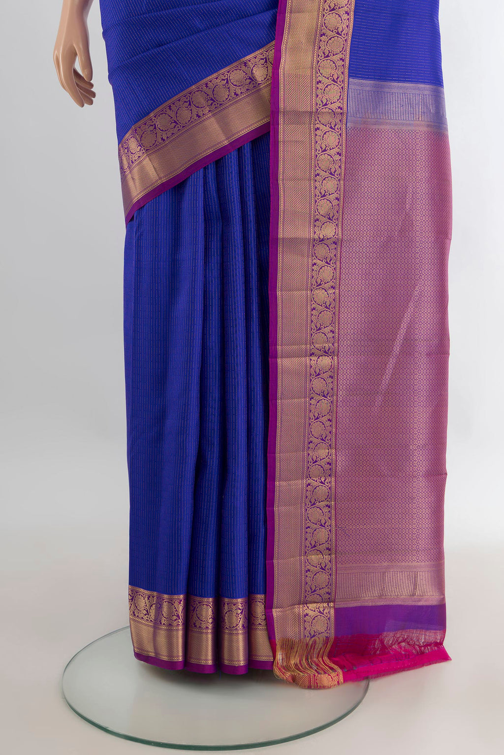 Pleats and pallu of Pure Silk Royal Blue Kanchipuram Saree with Stripes on the body and Zari Border. 