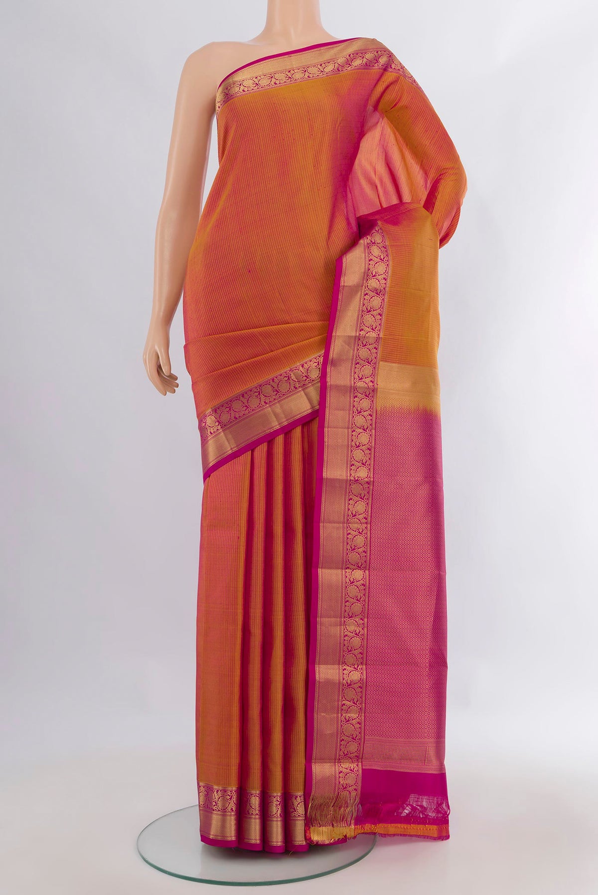 Pure Silk Mustard Dual Tone Kanchipuram Saree with Zari Butta on the body and Zari Border.  displayed on a mannequin