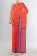 Pure Silk Orange Kanchipuram Saree with Zari Butta on the body and Zari Border.  displayed on a mannequin