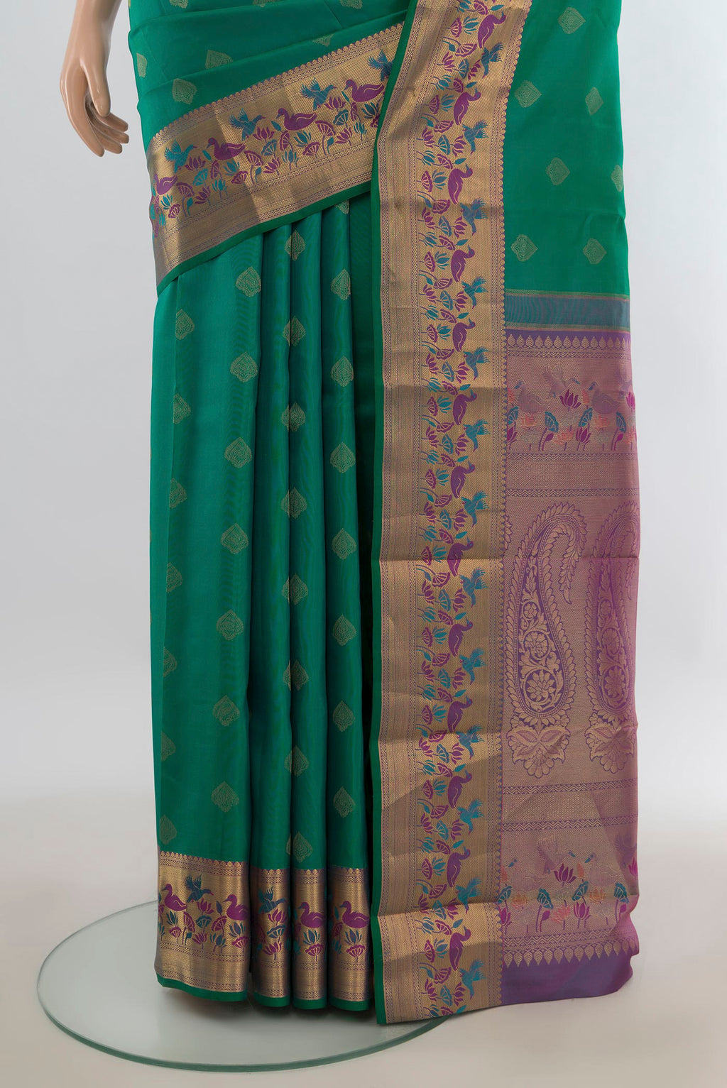 Pleats and pallu of Pure Silk Green Kanjivaram Saree with Zari Butta on the body and Zari Border. 