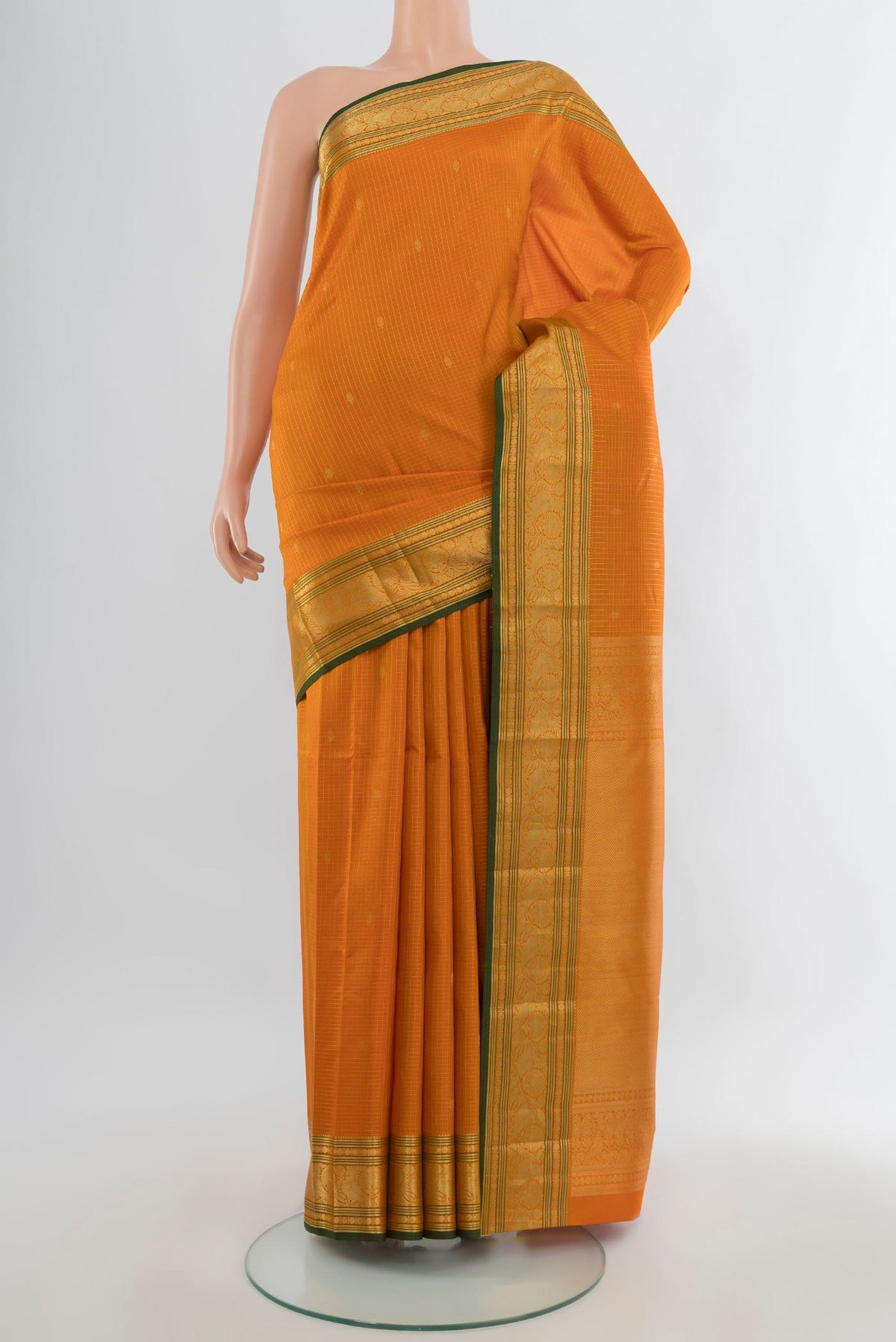 Pure Silk Orange Kanchipuram Saree with Checked design on the body and Zari Border.  displayed on a mannequin