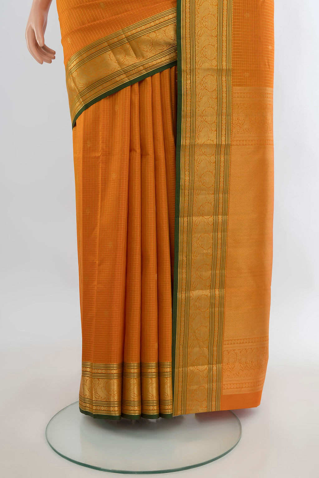 Pleats and pallu of Pure Silk Orange Kanchipuram Saree with Checked design on the body and Zari Border. 