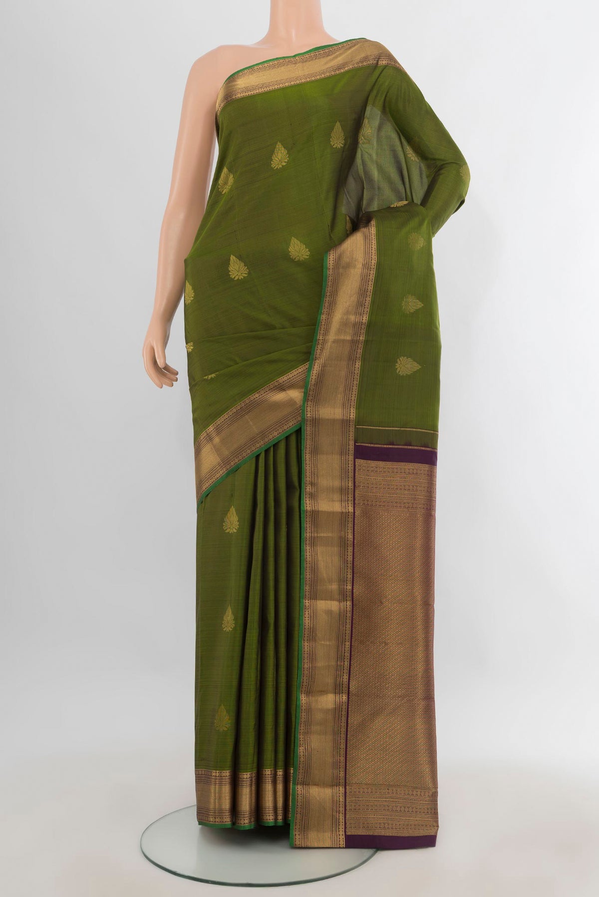 Pure Silk Mehandi Green Kanchipuram Saree with Zari Butta on the body and Zari Border.  displayed on a mannequin