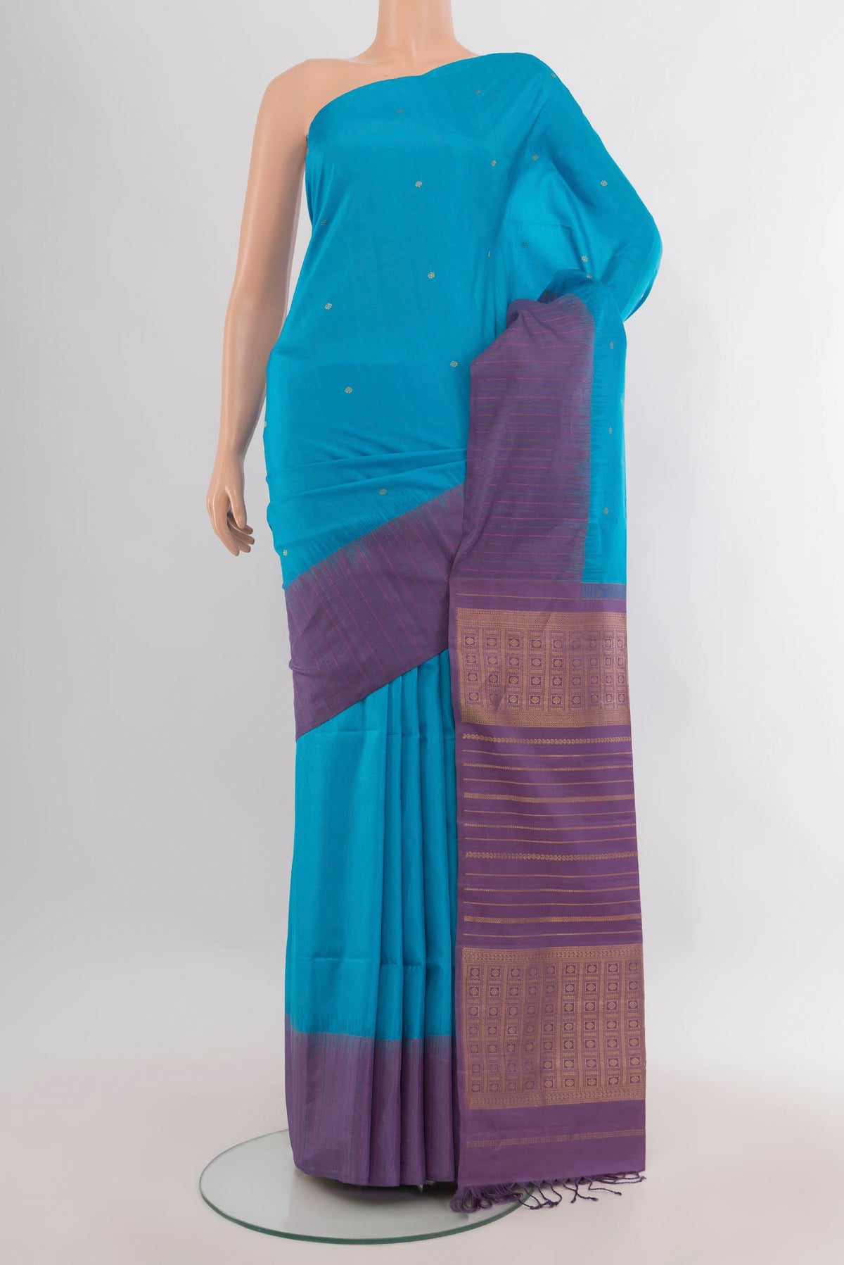 Pure Silk Light Blue Soft Saree with Zari Butta on the body and Plain Border.  displayed on a mannequin