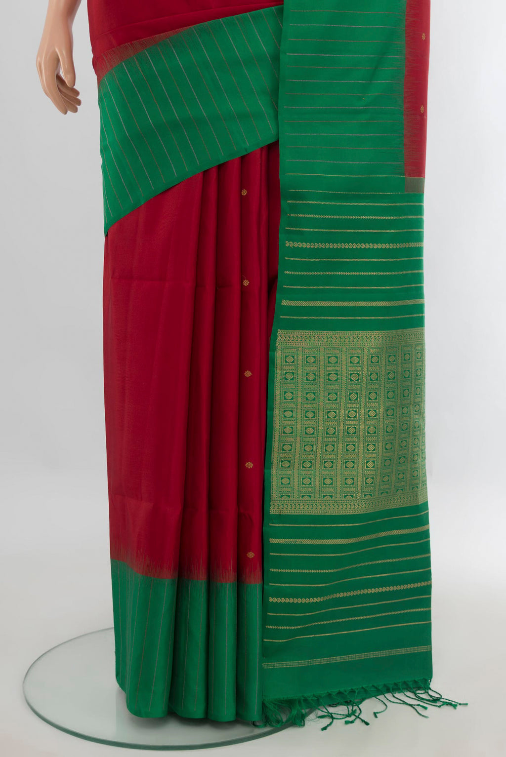 Pleats and pallu of Pure Silk Red Soft Saree with Zari Butta on the body and One Side Border. 