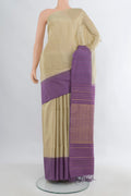 Pure Silk Beige Soft Saree with Zari Butta on the body and One Side Border.  displayed on a mannequin