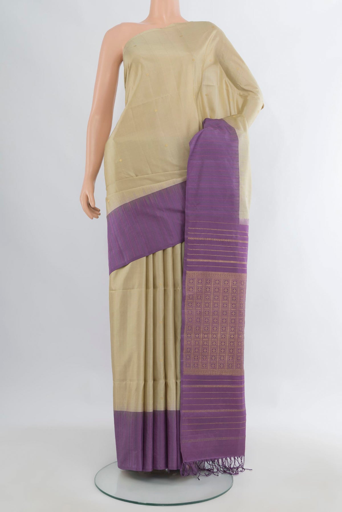 Pure Silk Beige Soft Saree with Zari Butta on the body and One Side Border.  displayed on a mannequin