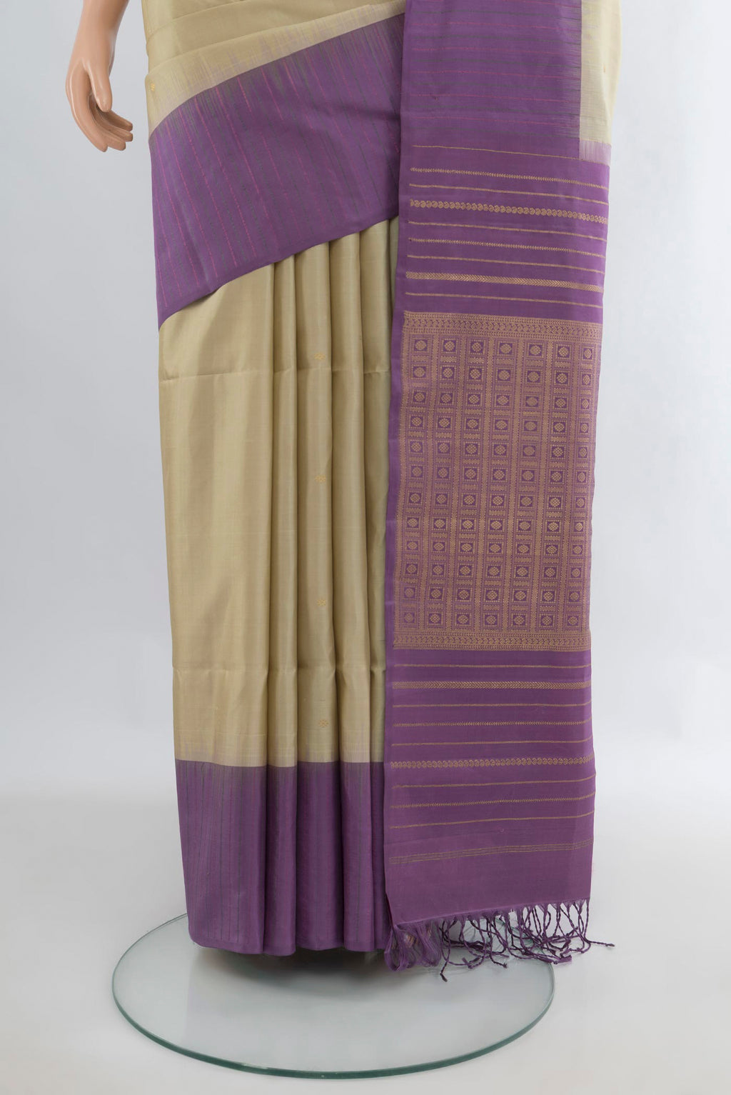 Pleats and pallu of Pure Silk Beige Soft Saree with Zari Butta on the body and One Side Border. 