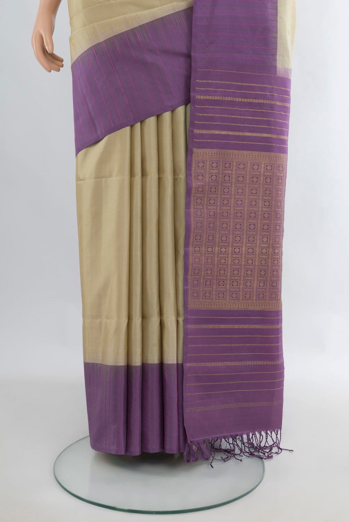 Pleats and pallu of Pure Silk Beige Soft Saree with Zari Butta on the body and One Side Border. 