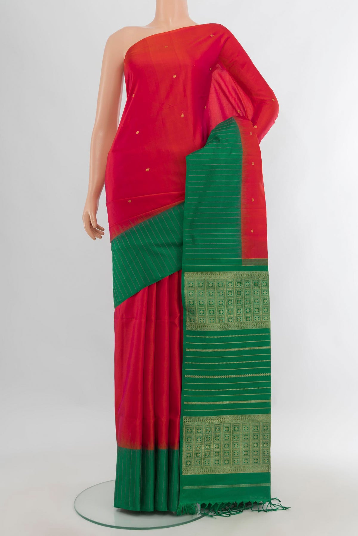 Pure Silk Red Soft Saree with Zari Butta on the body and One Side Border.  displayed on a mannequin