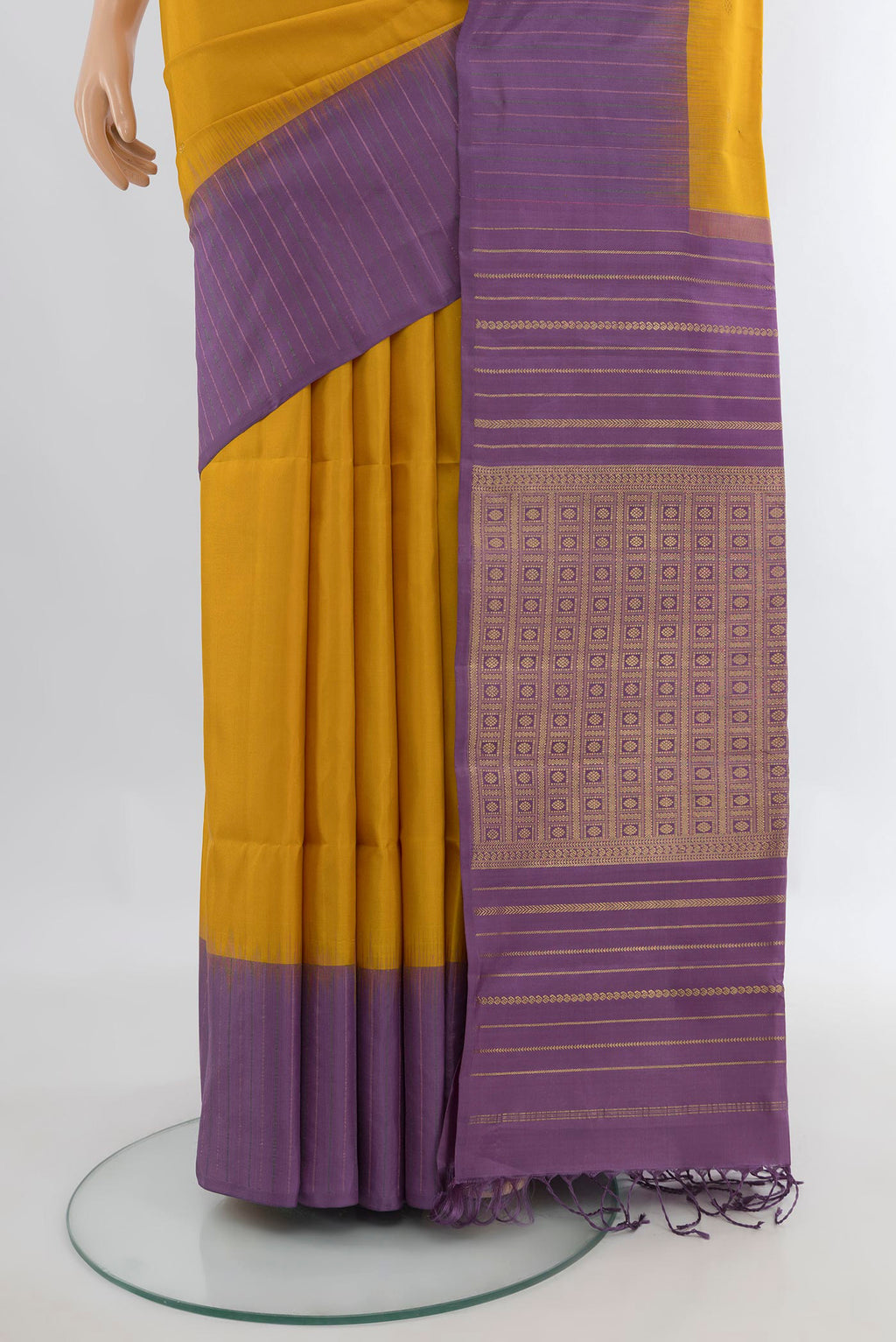 Pleats and pallu of Pure Silk Mustard Soft Saree with Zari Butta on the body and One Side Border. 