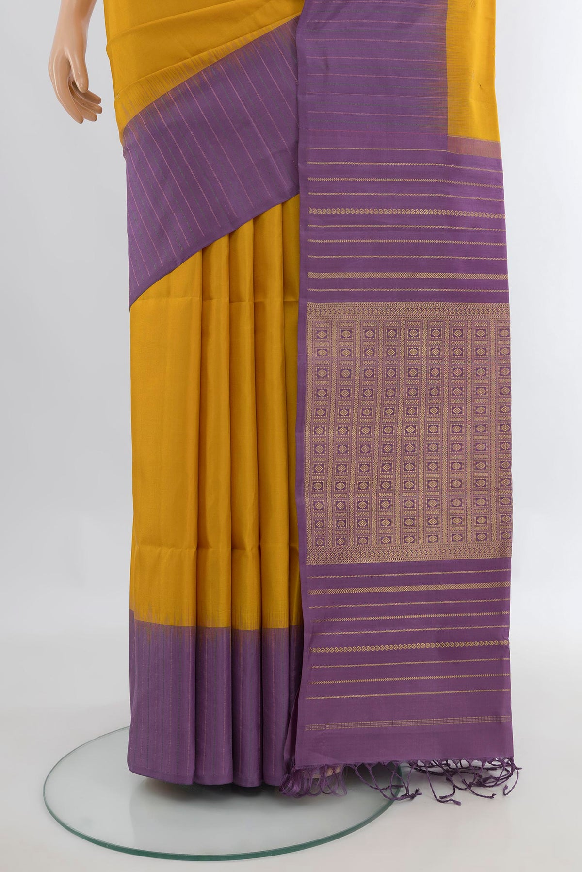 Pleats and pallu of Pure Silk Mustard Soft Saree with Zari Butta on the body and One Side Border. 